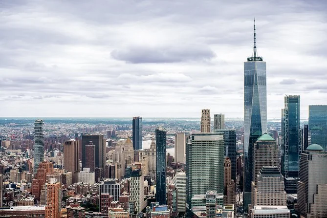 One World Trade Center and the Financial District from the air under a cloudy sky